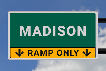 Madison logo. Madison lettering on a road sign. Signpost at entrance to Madison, USA. Green pointer in American style. Road sign in the United States of America. Sky in background