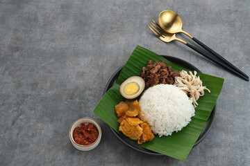 Gudeg, a typical food from Yogyakarta, Indonesia, made from young jackfruit cooked with coconut...
