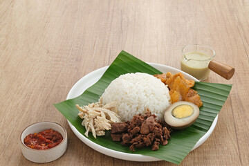 Gudeg, a typical food from Yogyakarta, Indonesia, made from young jackfruit cooked with coconut milk. Served with spicy stew of cattle skin crackers, brown eggs, shredded chicken and sambal.
