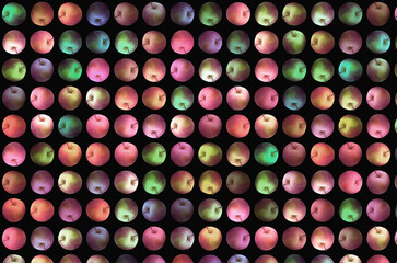 Cross weave of colored ripe apples on black background