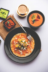 Mysore Masala Dosa or open dosa served with sambar and chutney, selective focus