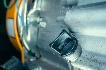 Plastic oil dipstick of an internal combustion engine close-up