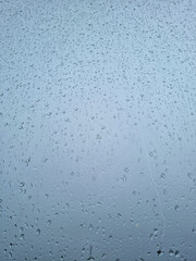 Water droplets on the window on a rainy day