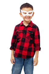 Fototapeta premium Happy kid wearing eye mask, playing superhero wearing red shirt isolated on white background