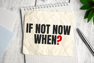 If not now, when note on wooden background and pen