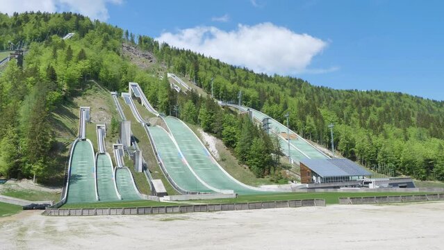 Smaller ski jumps at Planica in Slovenia in the summer with a colorful background