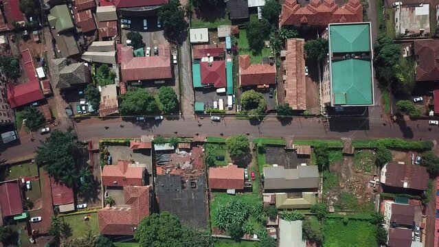 Drone look down to a street, road and housing area in Kampala city, Uganda