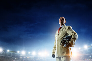 Businessman acting as american football players