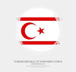 Obraz premium Creative circular grungy shape brush stroke flag of Turkish Republic of Northern Cyprus on a solid background