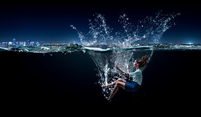 Young businesswoman swimming underwater . Mixed media
