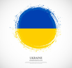 Creative circular grungy shape brush stroke flag of Ukraine on a solid background
