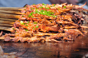 Roast squid at street market