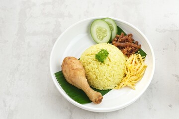 Nasi kuning, Indonesian traditional food, made from rice cooked with turmeric and coconut milk and spices.
