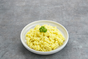 Nasi kuning, Indonesian traditional food, made from rice cooked with turmeric and coconut milk and spices.
