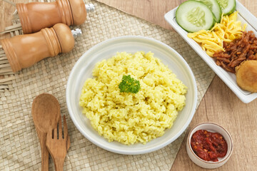 Nasi kuning, Indonesian traditional food, made from rice cooked with turmeric and coconut milk and spices.
