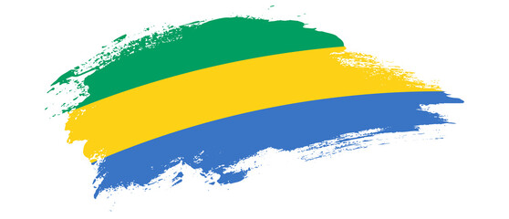 Obraz premium National flag of Gabon with curve stain brush stroke effect on white background