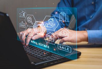 real estate concept, Businessman or home broker with virtual hologram property value on laptop...