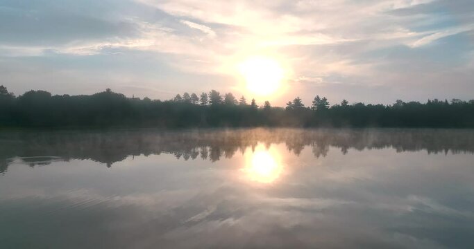 Beautiful Drone shot 4k over lake in Michigan at sunrise. 