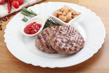 Grilled beef burger cutlet with sauce