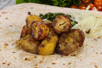 Baked potato with various herbs
