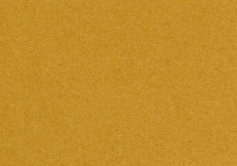 Highly detailed grainy, yellow, brown, uncoated, smooth paper board cardboard texture background with sand like structure and colorful particles with copyspace for mockup or high resolution wallpaper