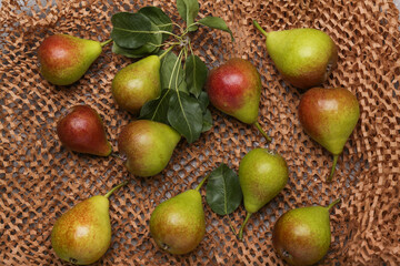 Ripe juicy pears on paper craft packaging, top view. 
