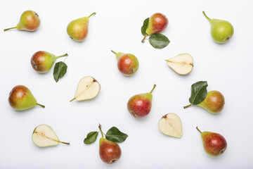 Fresh pears on light background, flat lay composition