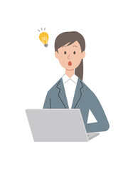 パソコン作業中にひらめくビジネスウーマン