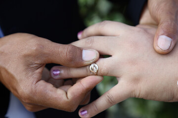 The bride and groom put their wedding rings on the wedding ceremony. happy bride and groom