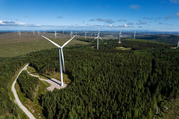 Aerial view on a wind electricity generator in a forest area of Connemara, county Galway, Ireland....