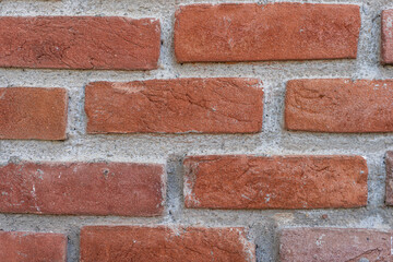 Red brick wall background, close up of a red exterior brick wall texture.