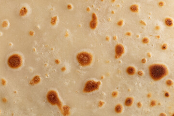 Pan fried pancake as a background.