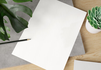 Blank paper on wooden desk Mockup. 3d rendering of A4 empty white sheet on concrete plate with monstera plant, cactus and pencil. - 518037102