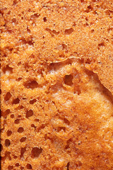 Crust on ruddy cookies as an abstract background.