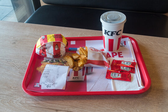 Pristina, Kosovo - June 5, 2022: KFC Menu With Spicy Sander Burger, Potato Wedges And Pepsi For Drink.