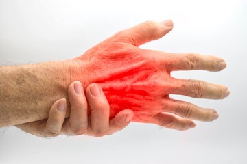 Pain in hand of Asian man. Concept of hand pain, tendinitis and joint problems.