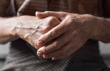 Hand of Asian elder man. Concept of rheumatoid arthritis, osteoarthritis, or joint pain