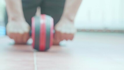 Exercise with abdominal exercise roller. Exercise equipment to reduce belly fat, build six packs and strong muscles.