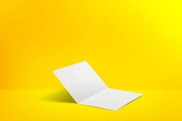 two-page white flyer mockup over a yellow gradient background