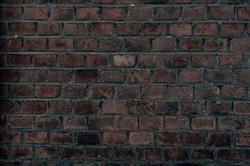 Old brick wall with red bricks close up.