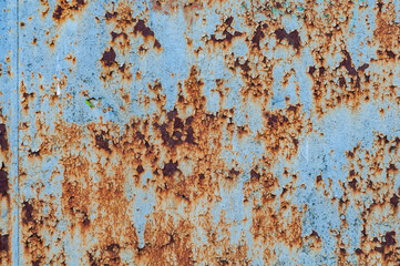 Background of old rusty burnt iron with peeling paint