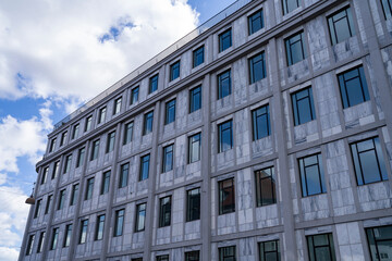 Fototapeta na wymiar Reflecting Window Glass on Symmetric Modern building brick facade in Downtown of Copenhagen, Denmark, Scandinavia.
