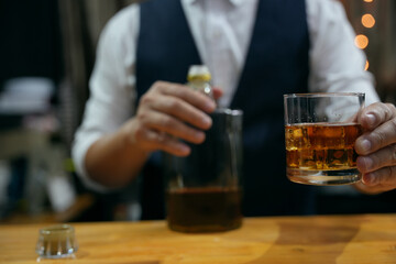 Barman pouring whiskey whiskey glass beautiful night