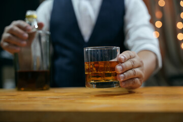 Barman pouring whiskey whiskey glass beautiful night