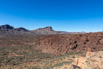 Panoramic view on mount Guajara, Roque de la Grieta in volcano Mount Teide National Park, Tenerife, Canary Islands, Spain, Europe. Volcanic barren desert landscape canyon. View from Minas de San Jose