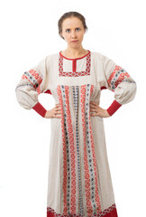 Fototapeta premium A woman in a Russian folk costume put her hands on her hips, a Russian woman looks at us with displeasure. portrait of a beautiful, cute girl. Russian beauty. village girl. isolated