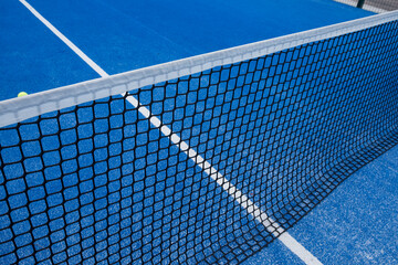 blue paddle tennis court netting, racket sports concept