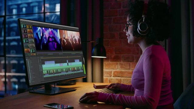 Professional Black Female Videographer Working on Desktop Computer, Editing Music Video Clip, Movie Scenes with Audio in Home Office. Creative Brazilian Artist Cutting Stylish Social Media Content