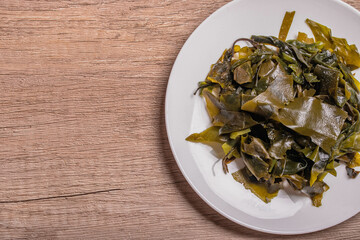 wakame seaweed in white dish, Japanese seaweed for cooking