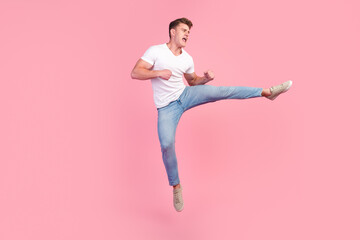 Full length photo of handsome guy jump high up dance strange dab moves isolated pastel color background